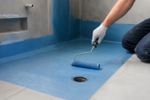 Bathroom waterproofing membrane applied to shower floor and walls